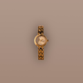 Flatlay of our Wavy Link Timepiece watch on a beige background