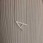 Large Sideways Initial Necklace in Sterling Silver showcased on a textured beige background.