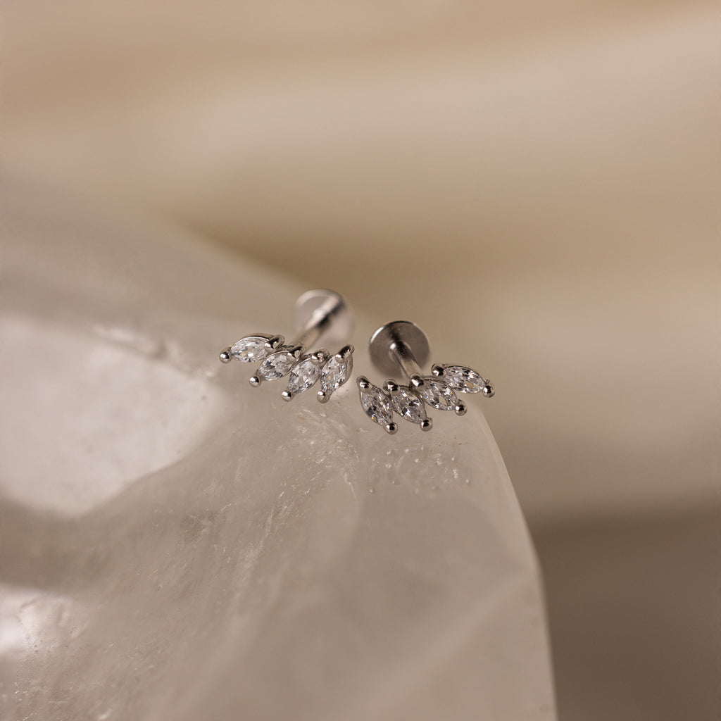Close-up of Marquise Diamond Climbers in Silver, featuring small marquise-shaped crystals on a smooth white stone—an elegant choice for wedding jewelry.