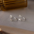 Duo Pet Initial Wrap Ring in Sterling Silver: a set of two rings—one with initials K and C, the other a custom dog-shaped design featuring the letter D.