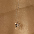 Diamond Bow Charm in Sterling Silver, adorned with CZ diamonds and set against a shimmering gold backdrop—a coquette-inspired accessory that sparkles with elegant charm.