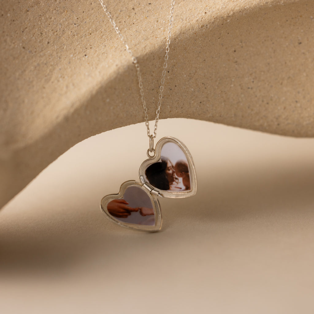 Close up photo of the inside of our Handwriting Heart Locket Necklace in Silver