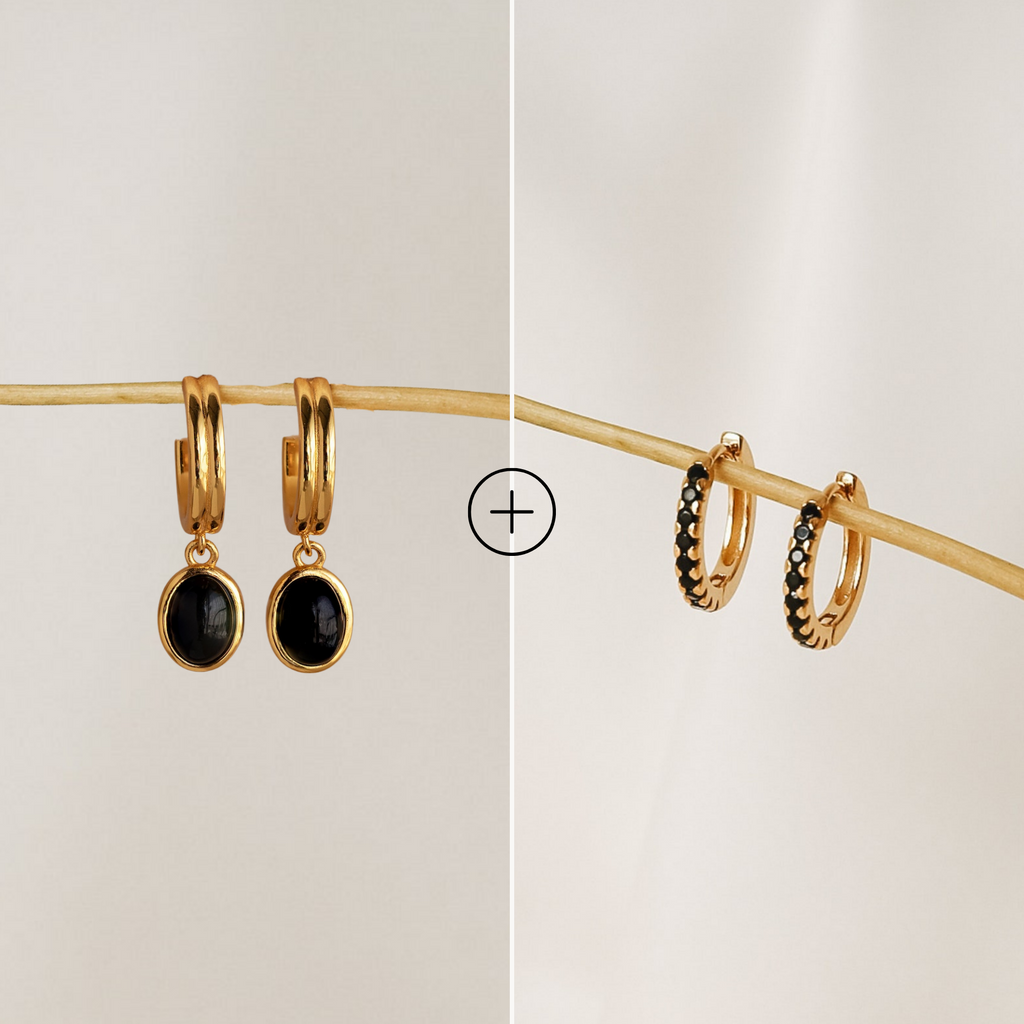 The Black Onyx Hoops Bundle features two side-by-side gold hoops: one Moonlight Black Huggie set with black oval stones, and one Black Gemstone Drop Hoop adorned with small black gems along the edge.
