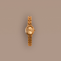 Our Cobblestone Timepiece watch on a beige background