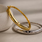 Close up of both the gold and silver North Star Diamond Bangle Bracelets.