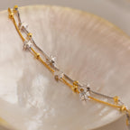 Close up of Mixed Metal Star Bracelet laying flat side on a dish.