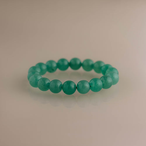 Bold Jade Beaded Bracelet with polished green gemstone beads, creating a timeless silhouette.