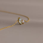 The Marquise Birthstone & Pearl Bracelet features a clear gemstone and small pearl—an elegant piece on a delicate chain, perfect as a thoughtful gift for someone special.