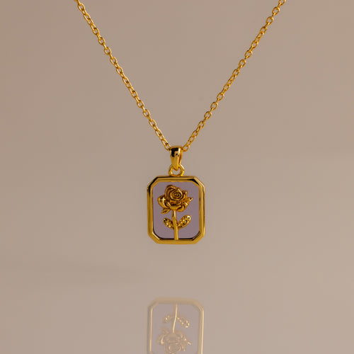 The Alexandrite Birth Flower Charm Necklace features a rectangular pendant with a rose design, making it ideal for layering or adding a subtle romantic touch to your style.