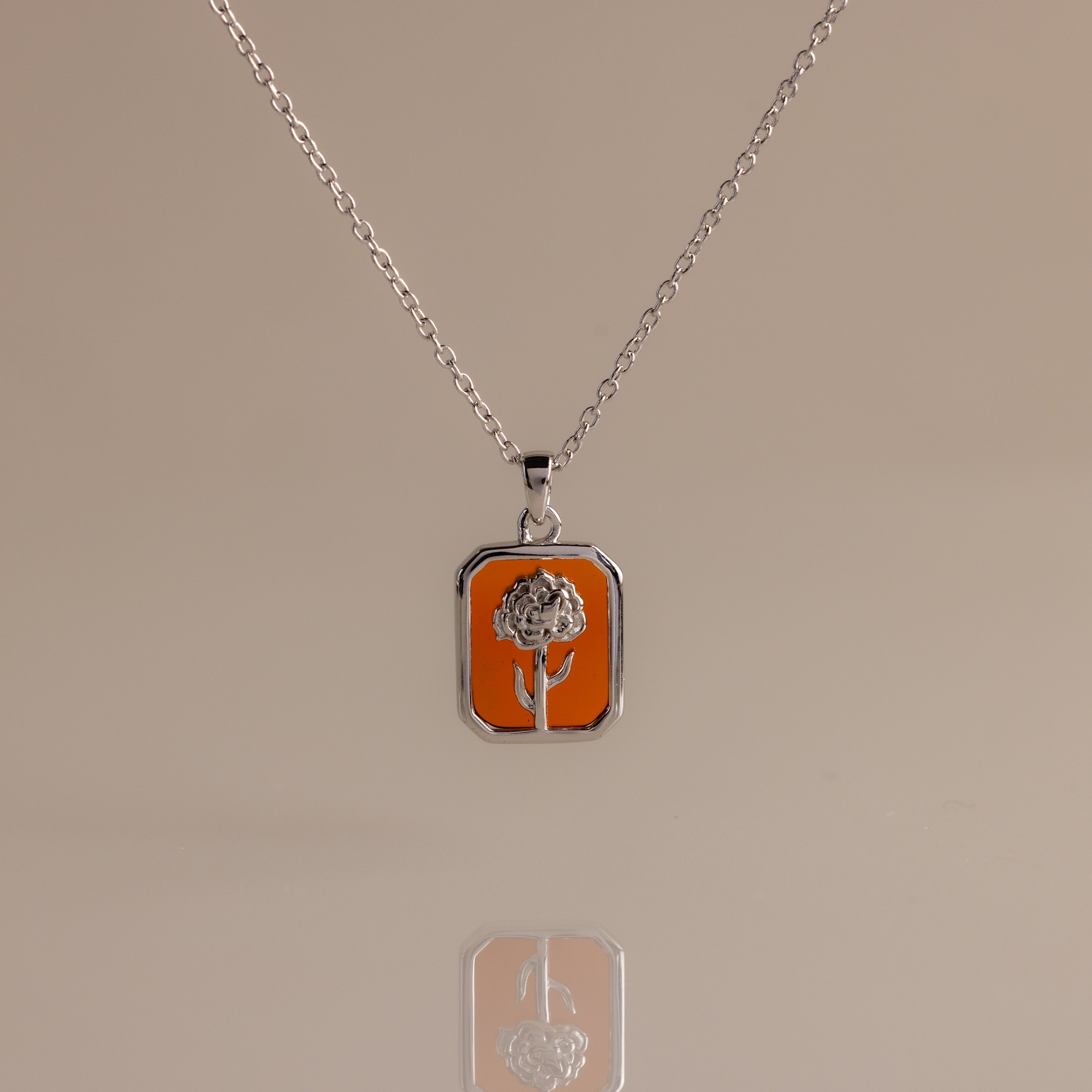 It seems you forgot to include the keywords. Please provide both the product description for the Garnet Birth Flower Charm Necklace inside [desc] and your list of keywords, and I’ll be happy to assist!.
