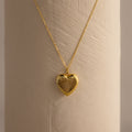 Close up of our Fingerprint Heart Locket Necklace in Gold