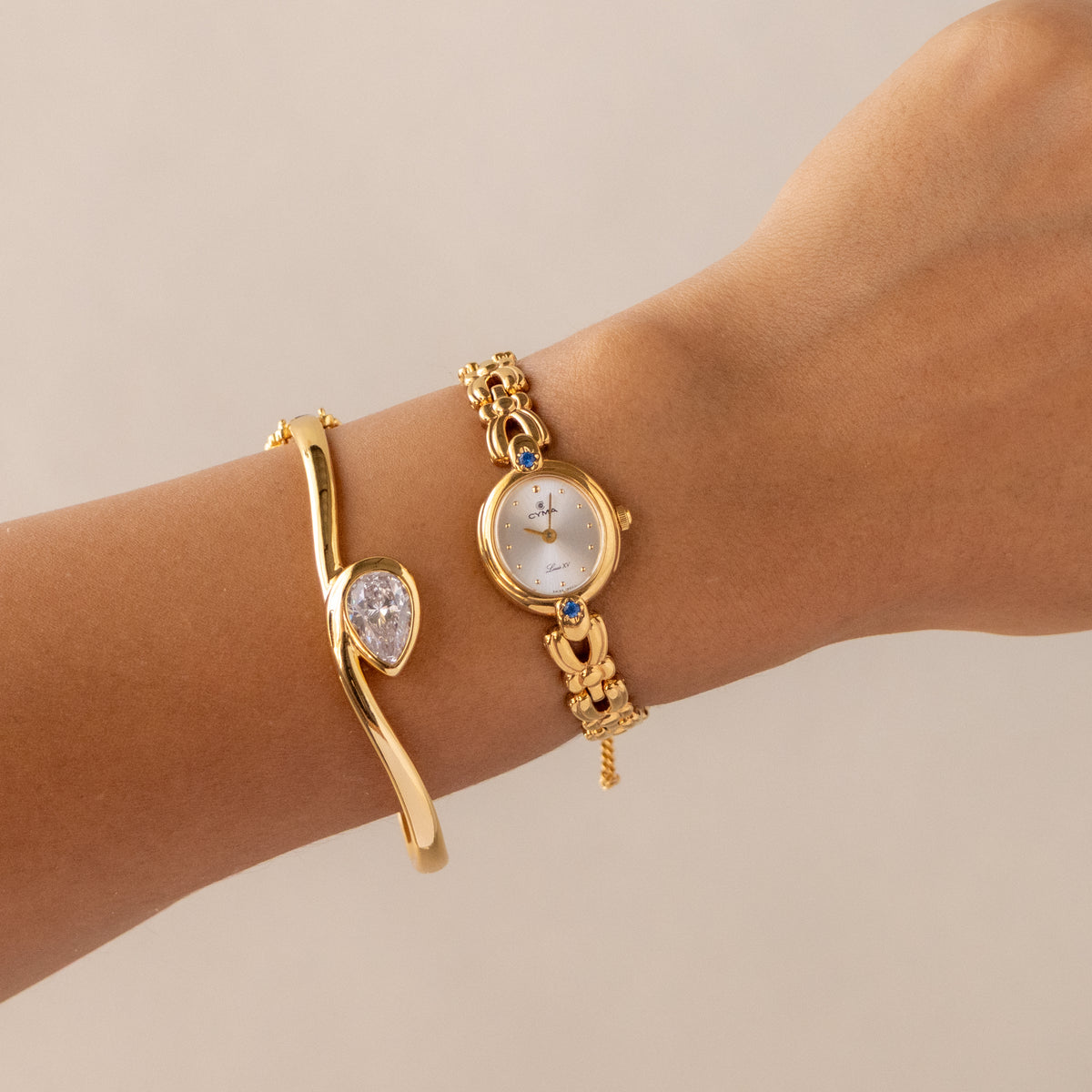 Vintage CYMA Round Sapphire Gold Watch