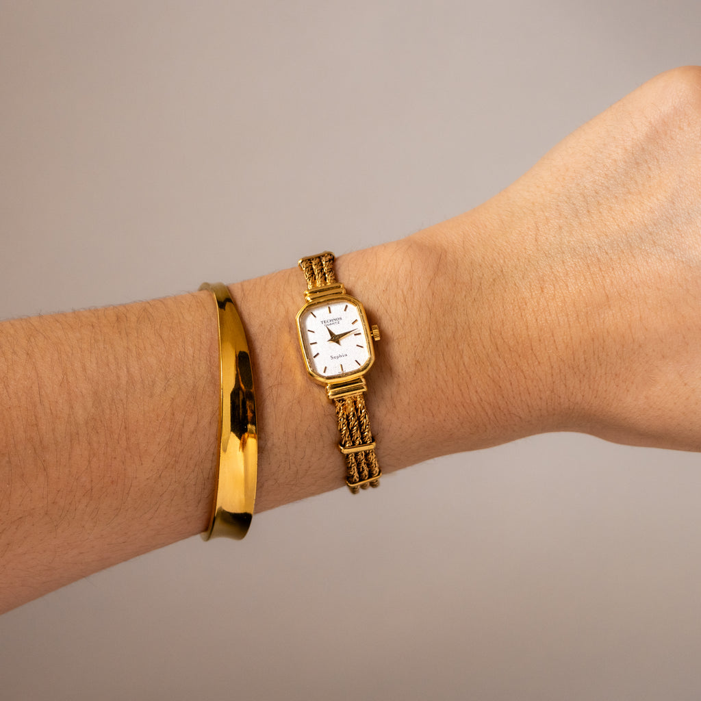 Vintage Technos Swiss Rectangular Rope Gold Watch
