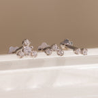Three silver crystal cluster flat back stud earrings displayed on a white surface, showing graduated two, three, and four stone designs.