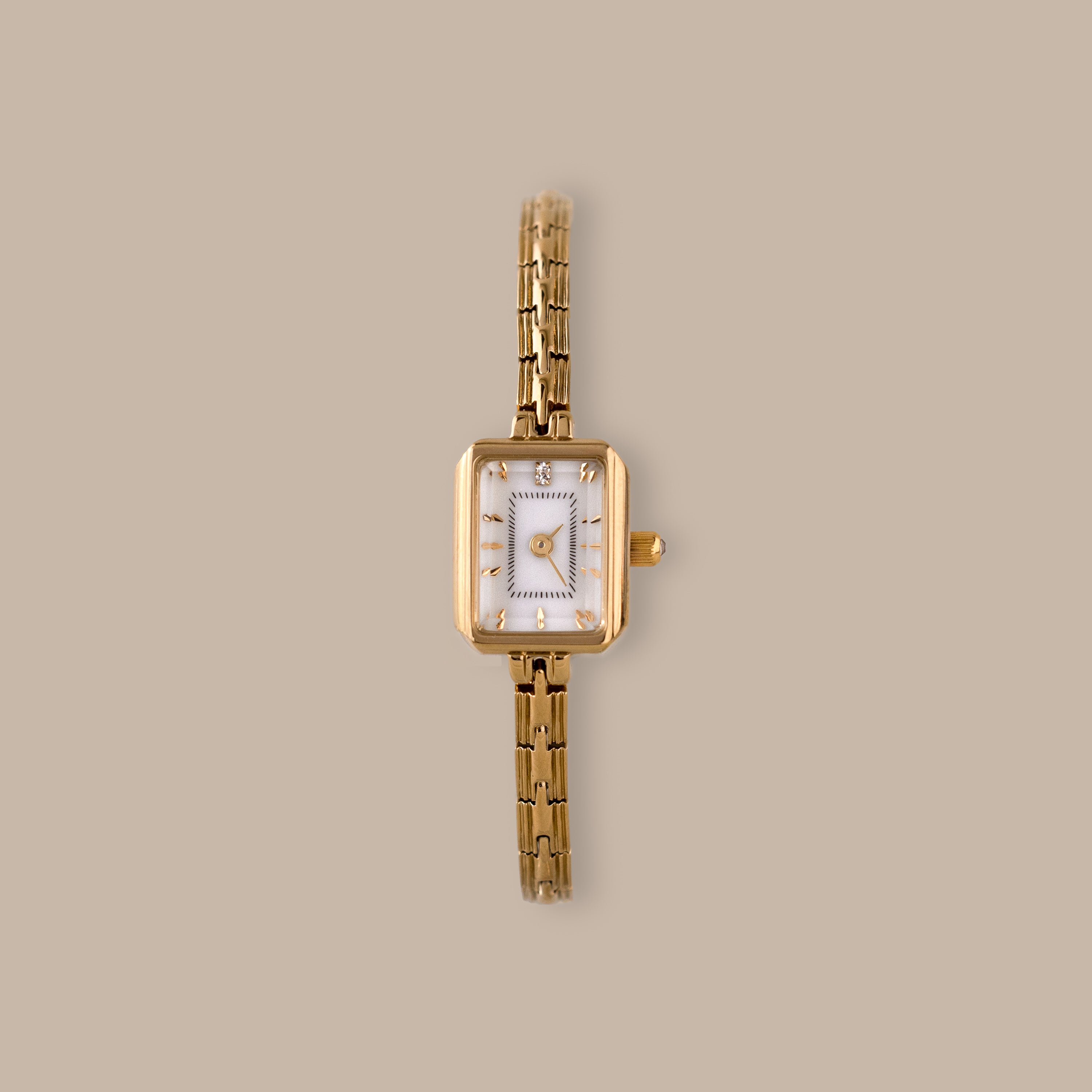 Divine Rectangular Link Timepiece with polished gold-tone case, white dial, and delicate link bracelet.