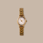 Elegant gold-tone oval link timepiece with a minimalist white dial.