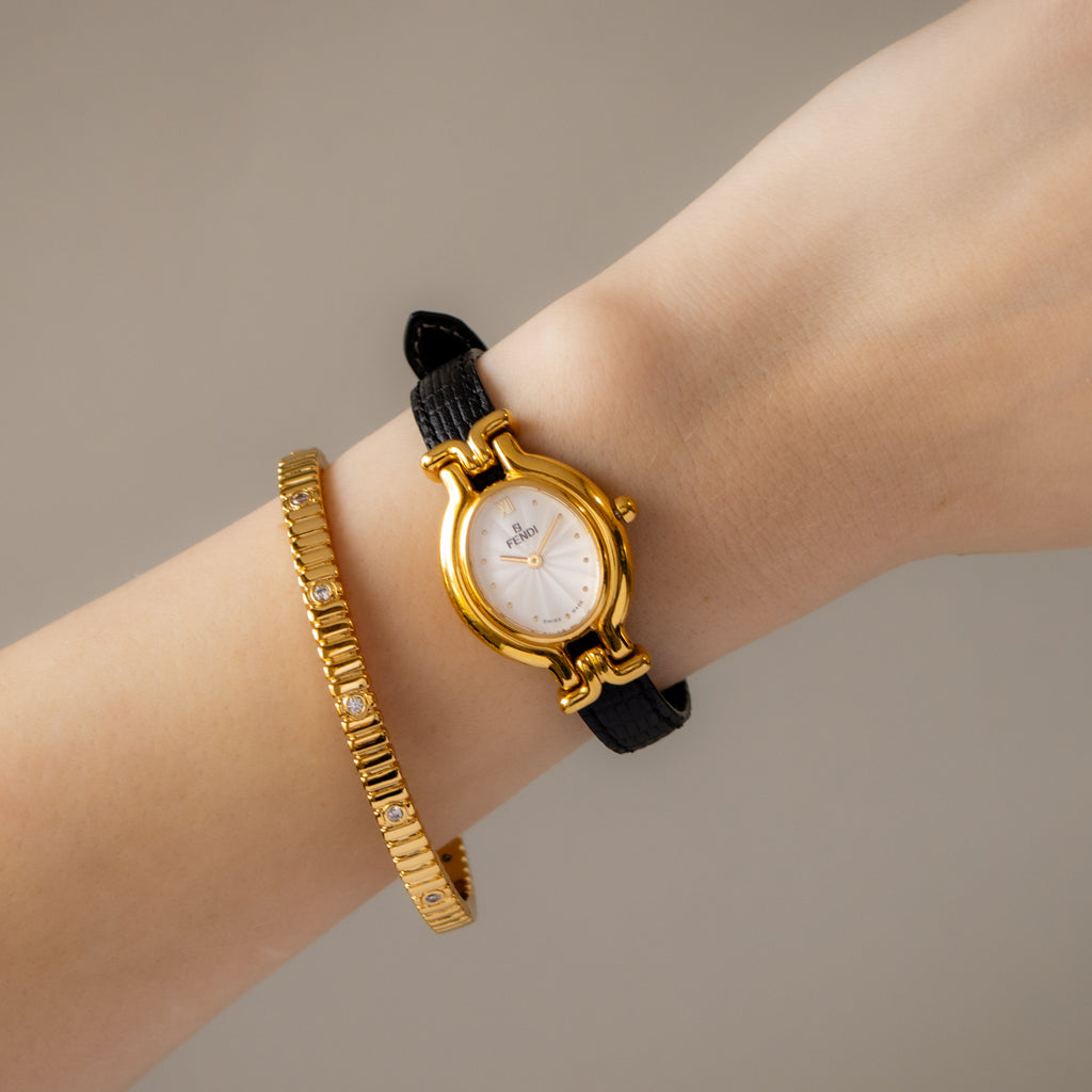 Vintage Fendi Swiss Oval Black Strap Gold Watch