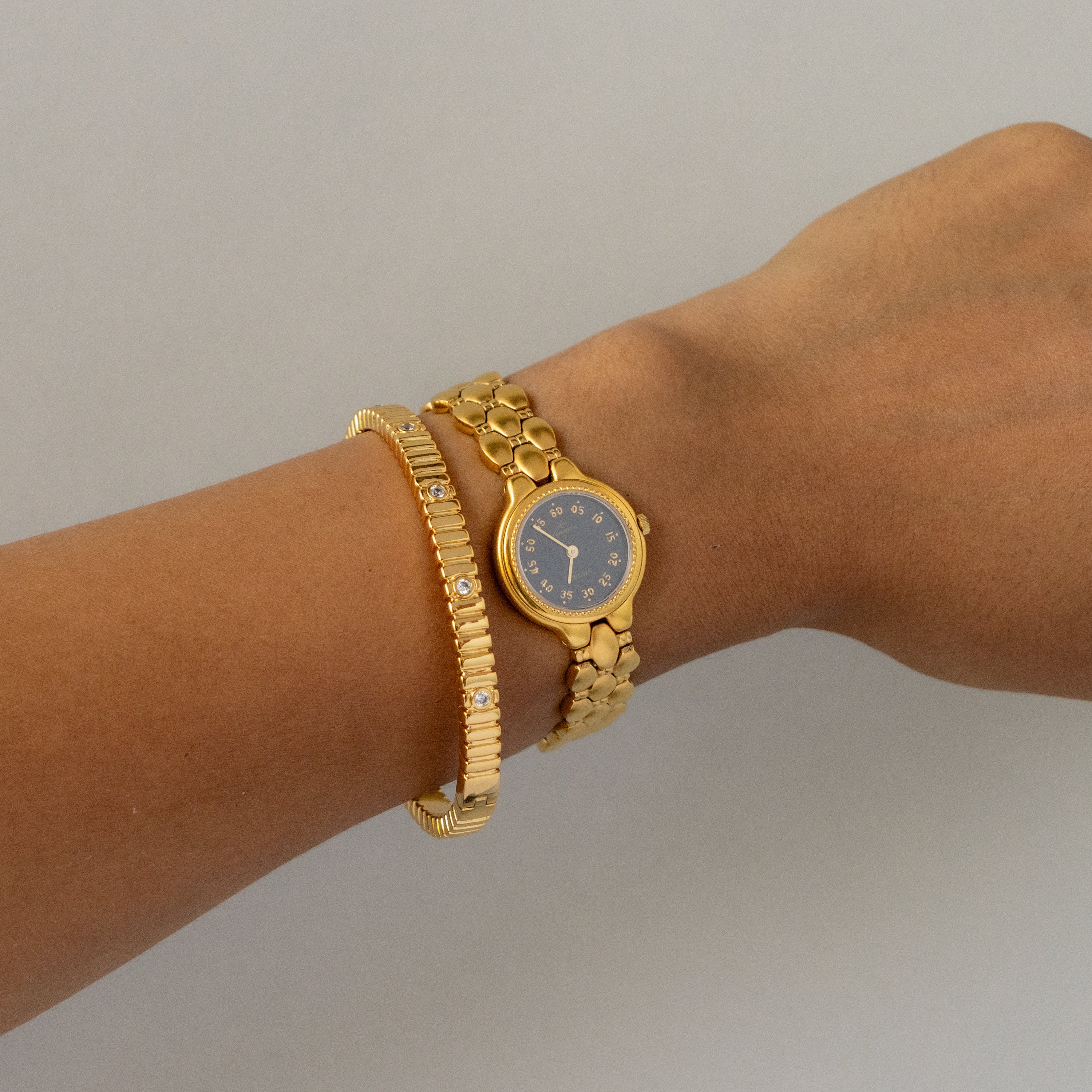 Vintage Delma Swiss Midnight Gold Watch