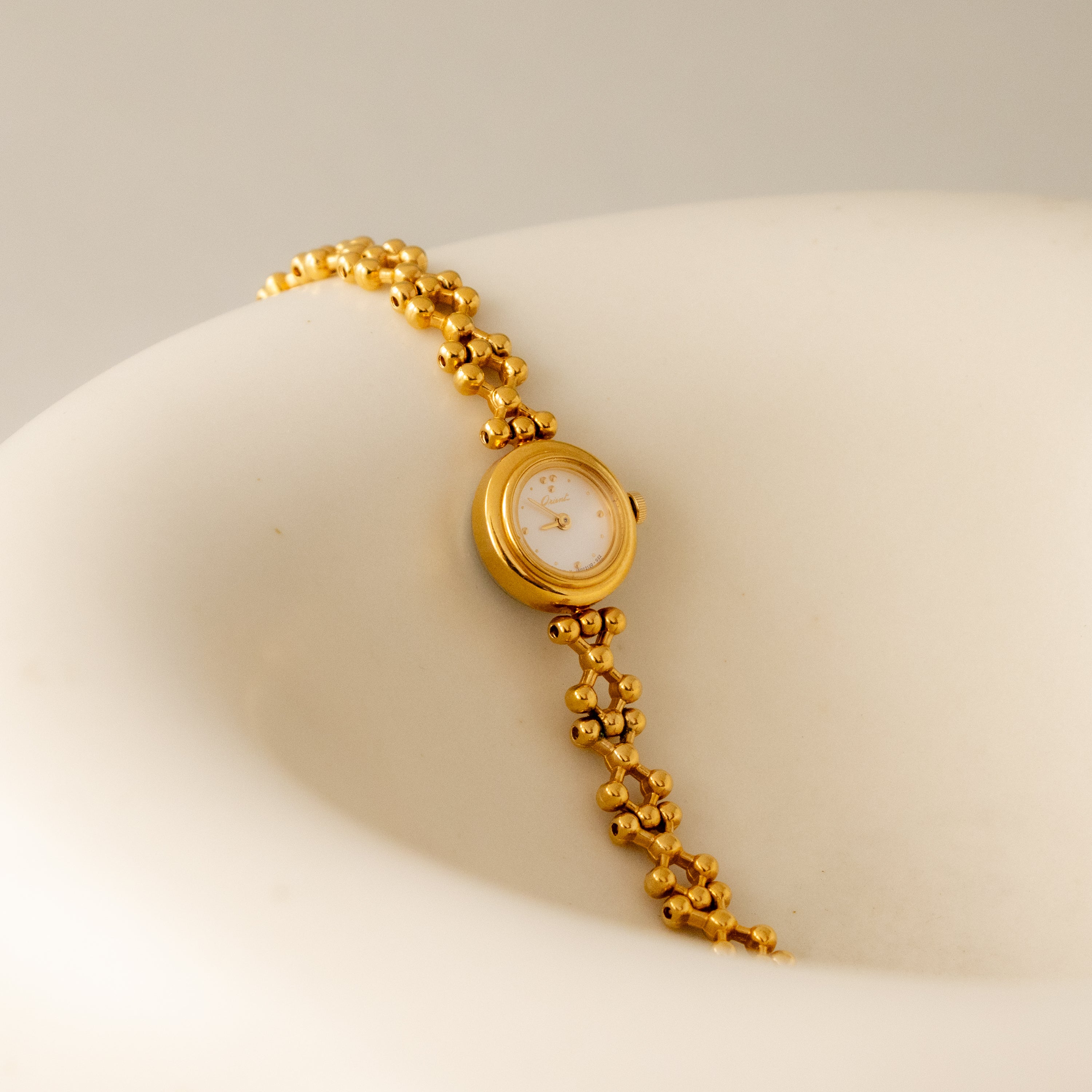 Vintage Orient Round Beaded Gold Watch