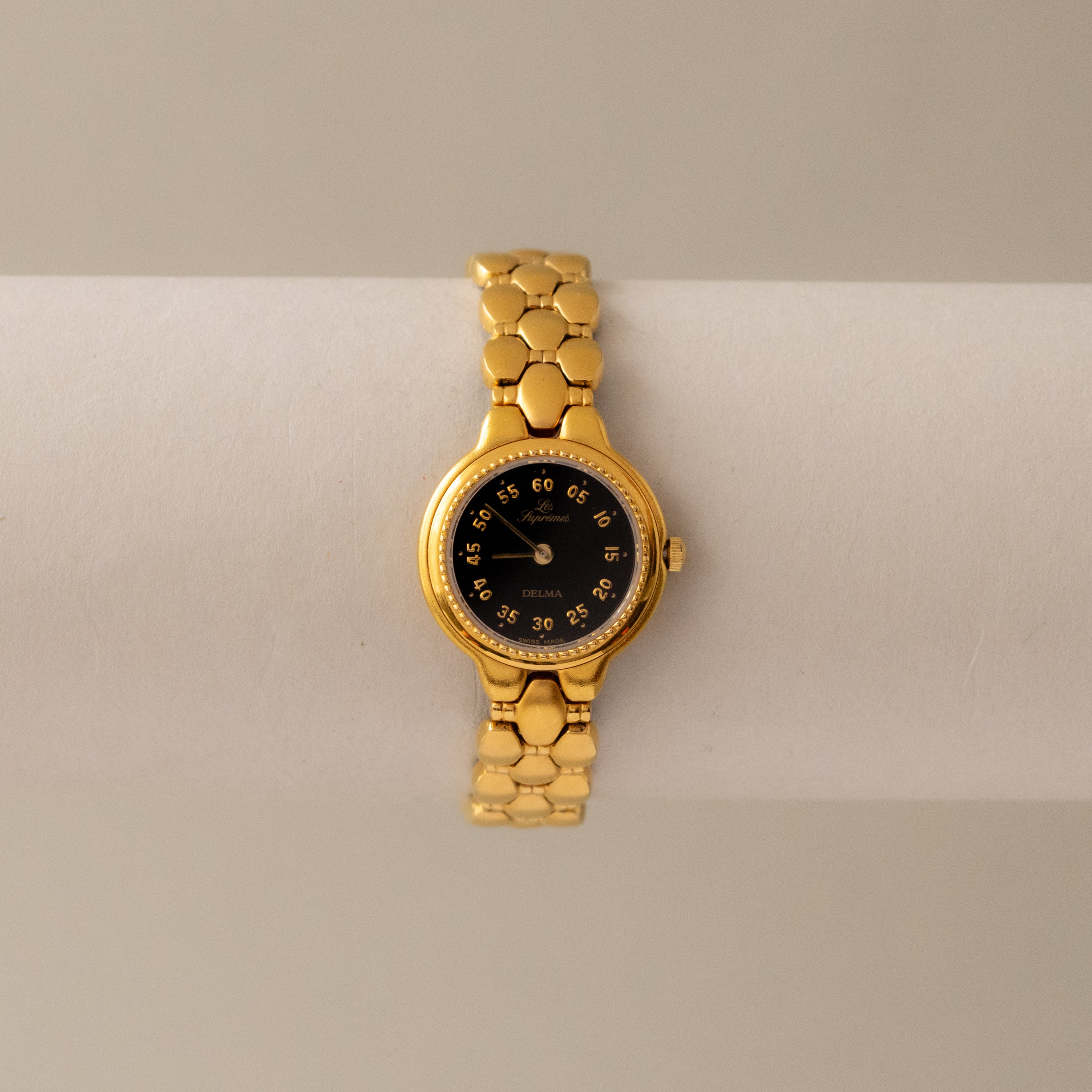 Vintage Delma Swiss Midnight Gold Watch