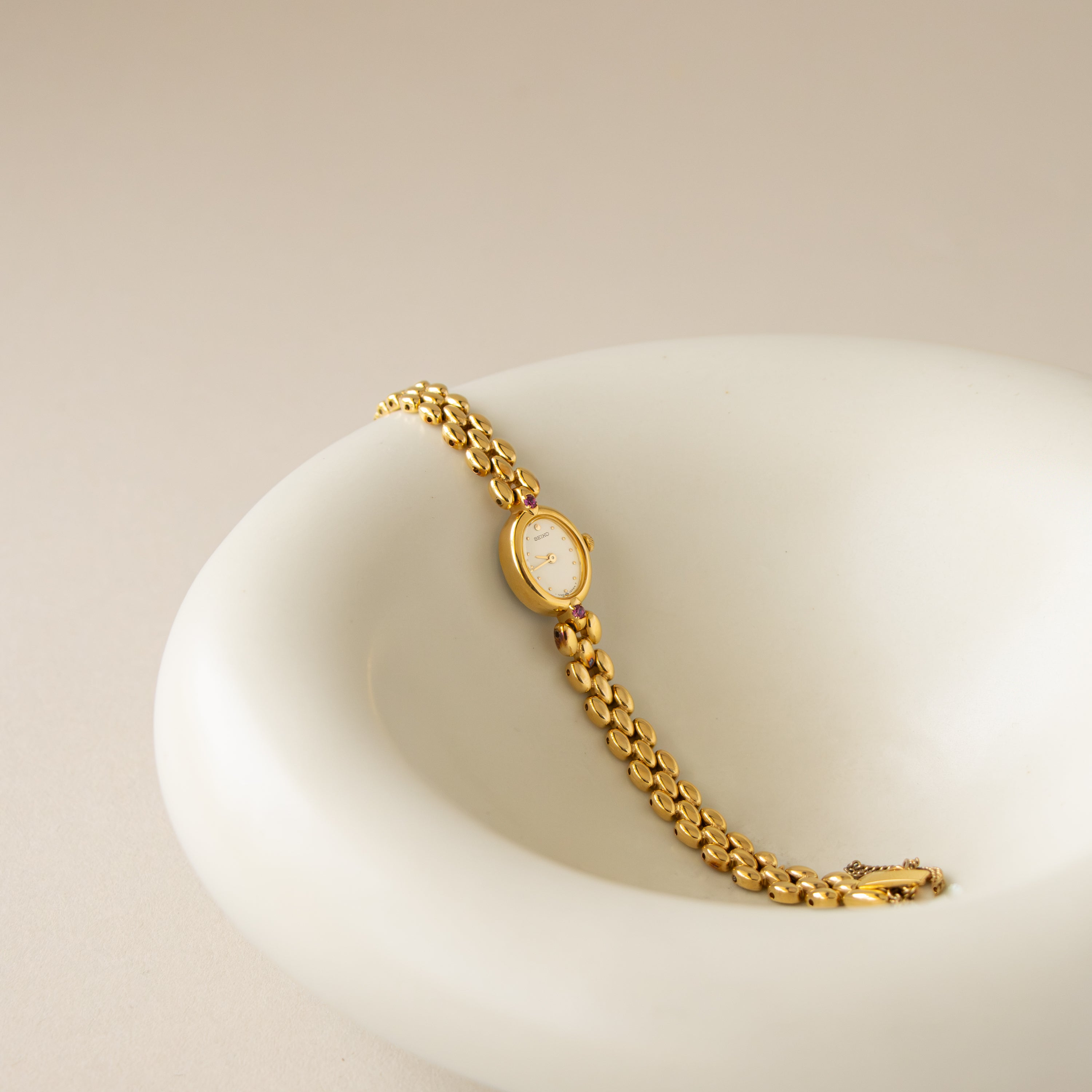 Vintage Seiko Oval Ruby Beaded Gold Watch