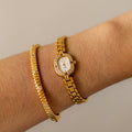 Vintage Technos Swiss Oval Pave Ruby Gold Watch