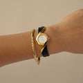 Vintage Courreges Round Black Strap Gold Watch