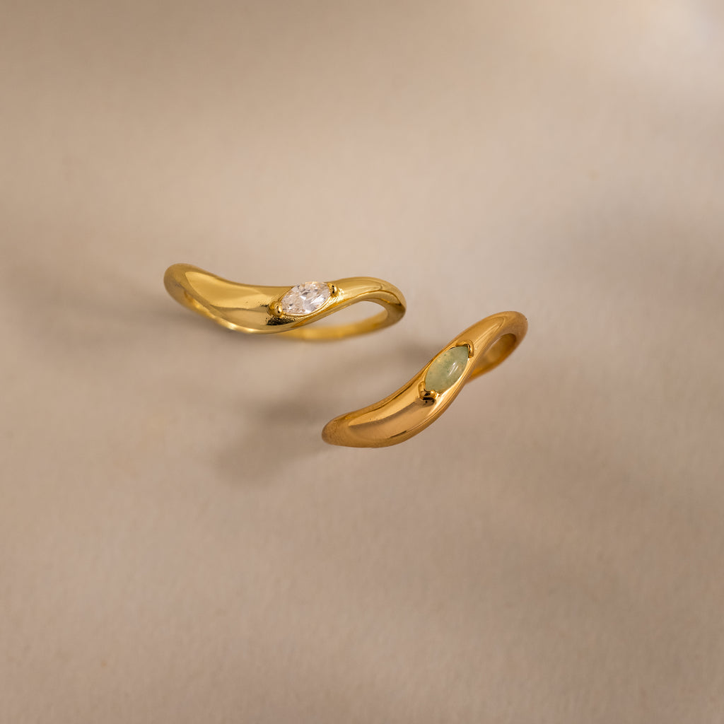 Two Zen Gemstone Curve Rings with curved bands and subtle gemstone accents are shown on a neutral background—ideal minimalist rings.