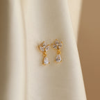 Puces d'oreilles pendantes diamant marquise