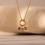 Square Bezel Pink Tourmaline Charm—a gold necklace featuring a square bezel pendant with a vibrant pink tourmaline gemstone, perfect as a birthstone charm or for lovers of gemstone jewelry.