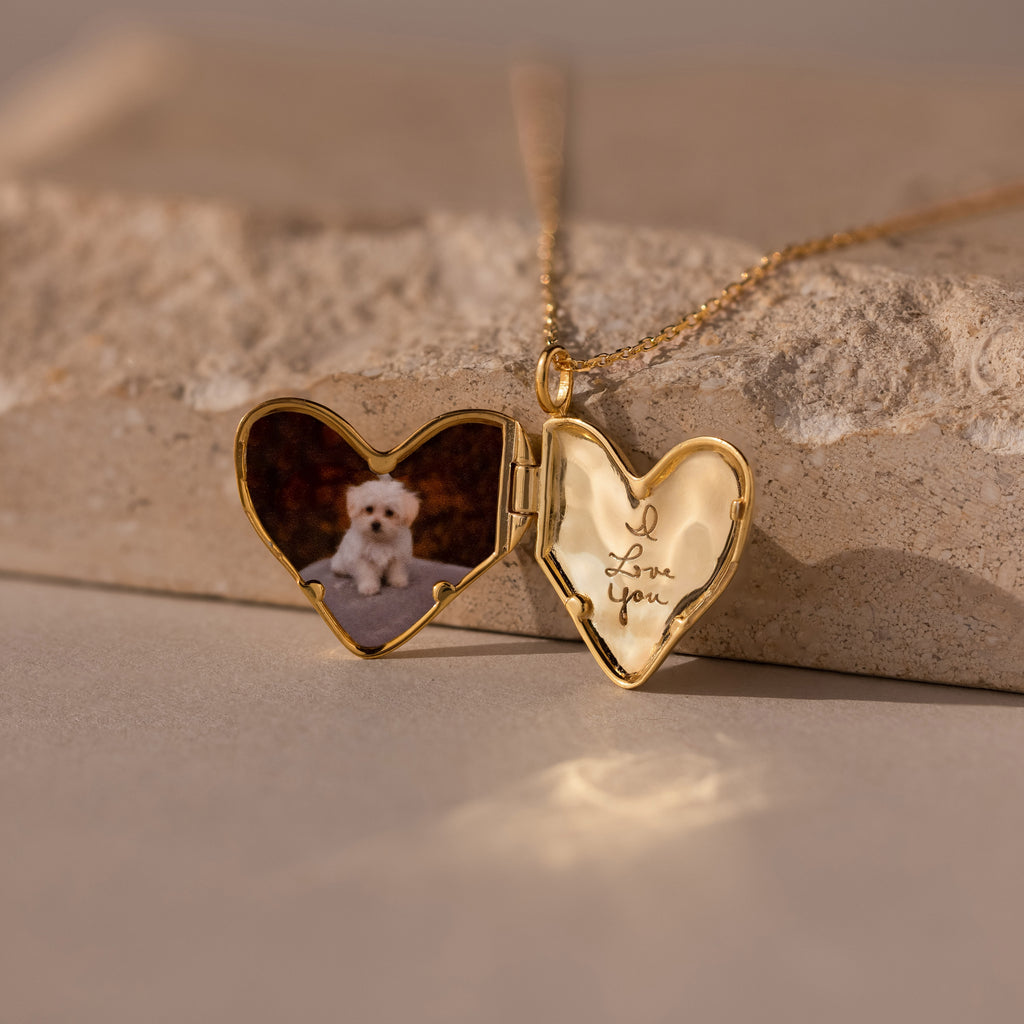The Organic Heart Locket Necklace in 18K Gold features a heart shape with a dog photo inside and "I love you" engraved—an ideal keepsake for someone special.