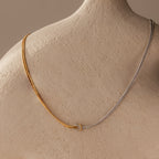Love Knot Chain Necklace in Mixed Metal displayed on a neutral textured mannequin bust.