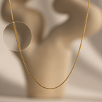Gold box chain on a neutral background
