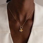A modern essential, the Large Rolo Clasp Necklace features gold links and a bold chain detail—perfect for layering over a white blazer.
