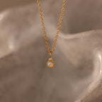 Close up image of our Opal Diamond Necklace in 18K Gold