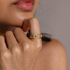 A woman’s hand with the Duo Aquamarine Tennis Linked Ring Set rests gently against her chin, the delicate bands sparkling with subtle elegance.