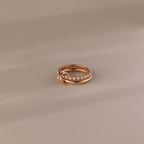 The Duo Opal Tennis Linked Ring Set features a delicate gold beaded design with interlocking loops, beautifully presented on a neutral background.