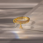 Linked Initial Birthstone Ring Set in Pink Tourmaline (October), displayed on a reflective light gray surface—an ideal personalized birthstone jewelry piece.
