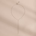 Silver mirror chain lariat necklace displayed on a neutral background.
