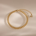 The Fishtail Chain Bracelet in 18K Gold features interwoven, leaf-shaped links and detailed craftsmanship with an adjustable clasp, displayed on a neutral background.