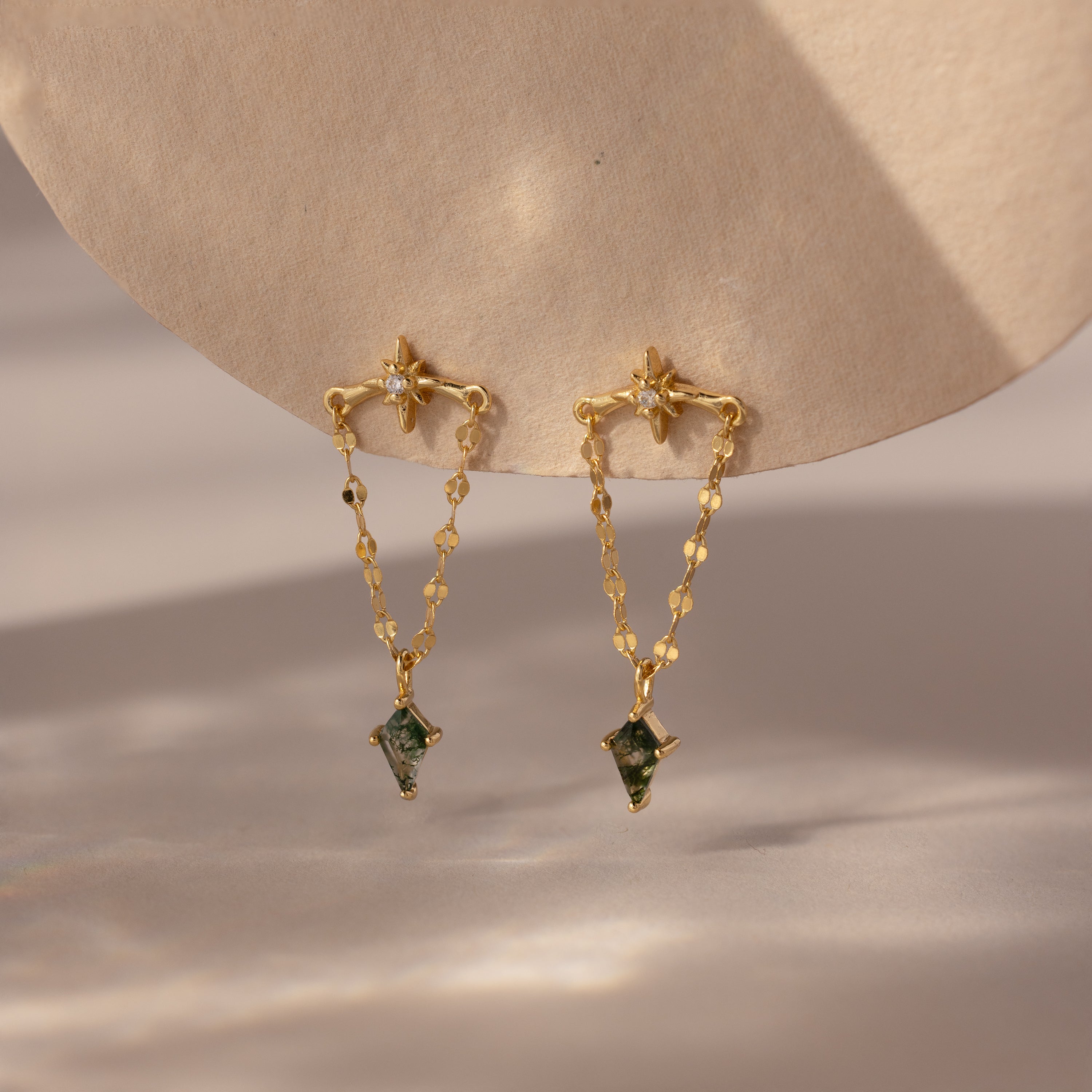 Agate Star Chain Earrings in 18K Gold featuring celestial design, delicate chain dangles, and green agate accents, displayed on a neutral background.