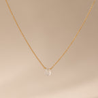 Teardrop Moonstone Necklace in 18K Gold, featuring a gold chain and a single moonstone pendant, elegantly displayed on a beige background.