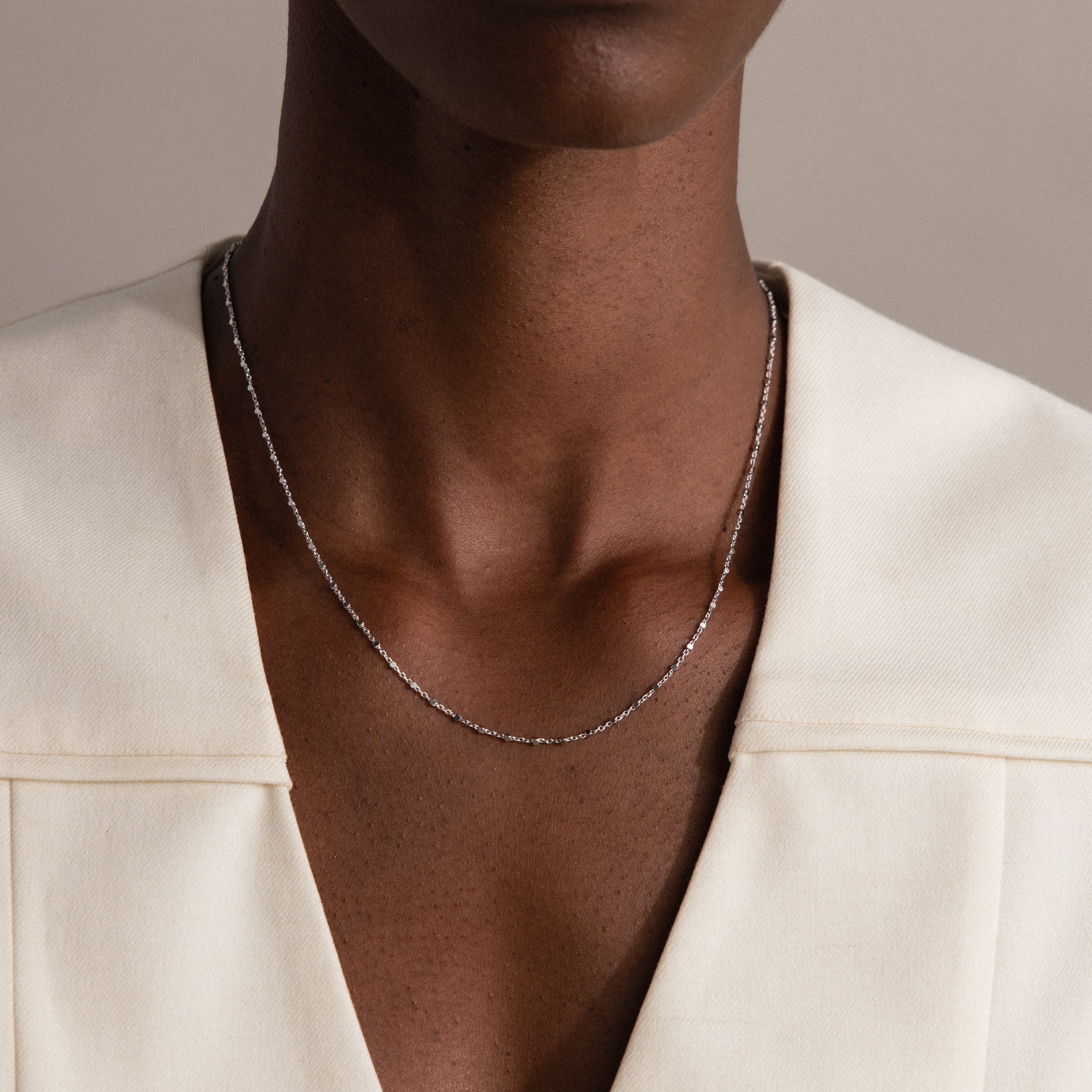 A woman wearing the Dot Station Necklace in Sterling Silver.