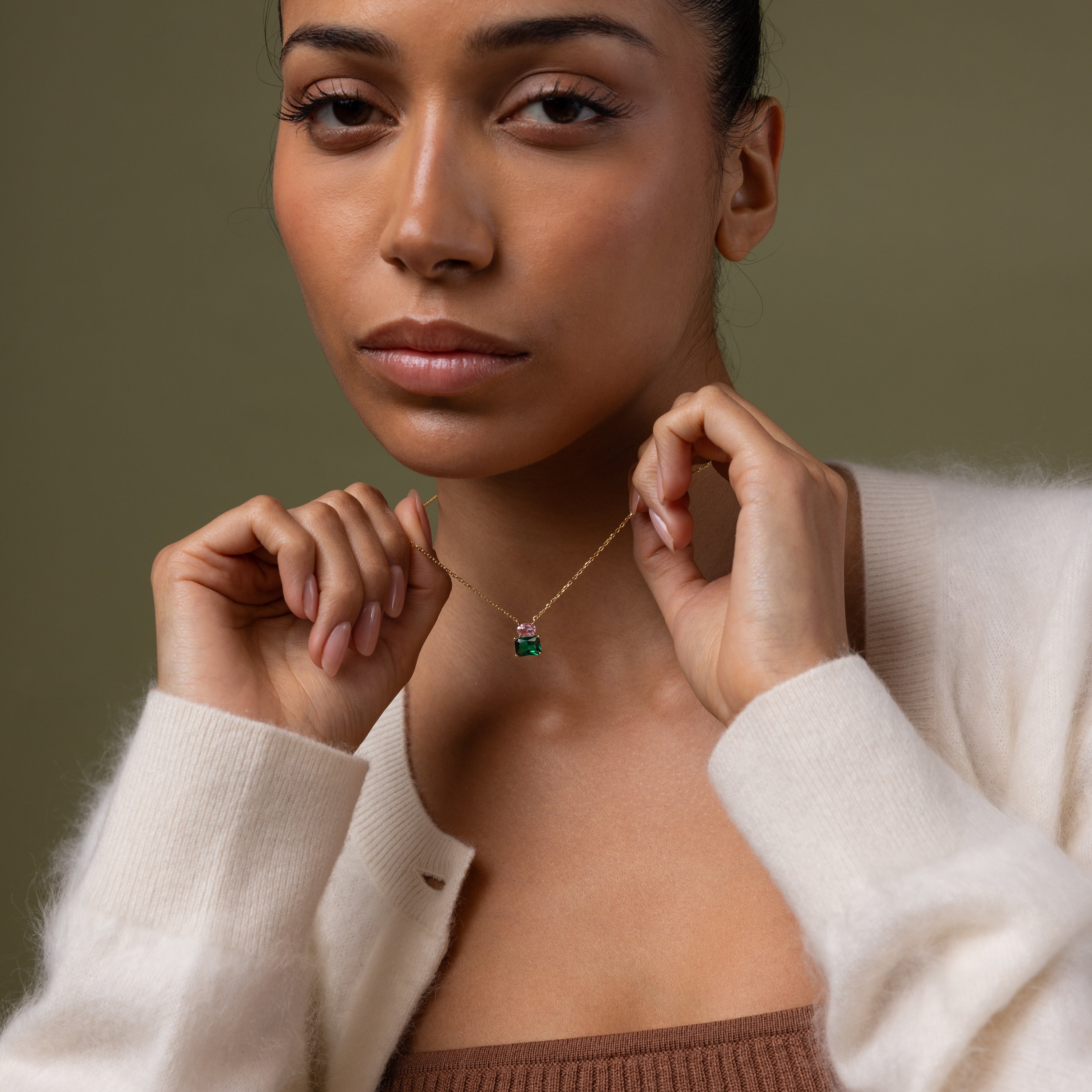 Model showcasing our Emerald Bloom Necklace with Pink Tourmaline and Emerald gemstones