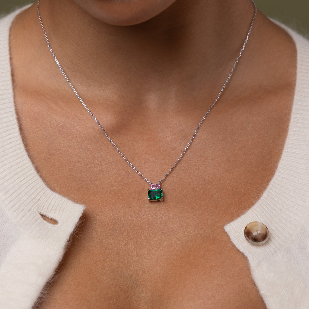 Model wearing our Emerald Bloom Necklace with Pink Tourmaline and Emerald gemstones.