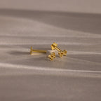 Flatlay of our Tiny Bow Flatback Studs in Gold, with the flatback post separated