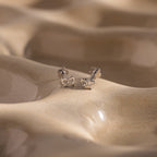 Close up of our Tiny Bow Flatback Studs in Silver
