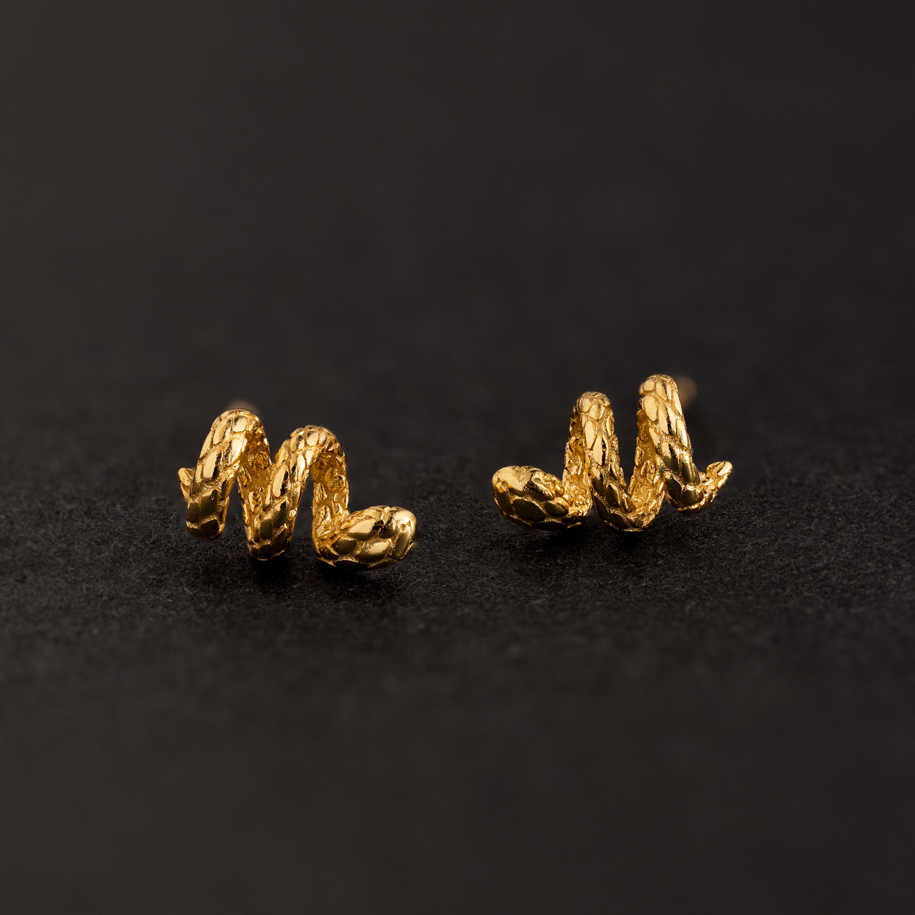 Clous d'oreilles serpent torsadés en or 18 carats