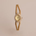 Our Duo Chain Diamond Timepiece on a beige background