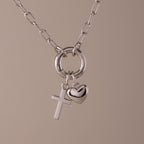 Cross & Heart Charm Bracelet in Silver displayed on a neutral background.
